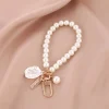 ⁦Fashion Pearl Key Chain Car Keychain Pendant Shell Heart Lettering Metal Charm Women's Handbag Accessories Jewelry Girl's Gifts⁩ - الصورة ⁦4⁩