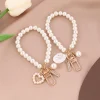 ⁦Fashion Pearl Key Chain Car Keychain Pendant Shell Heart Lettering Metal Charm Women's Handbag Accessories Jewelry Girl's Gifts⁩ - الصورة ⁦2⁩