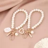 ⁦Fashion Pearl Key Chain Car Keychain Pendant Shell Heart Lettering Metal Charm Women's Handbag Accessories Jewelry Girl's Gifts⁩ - الصورة ⁦3⁩